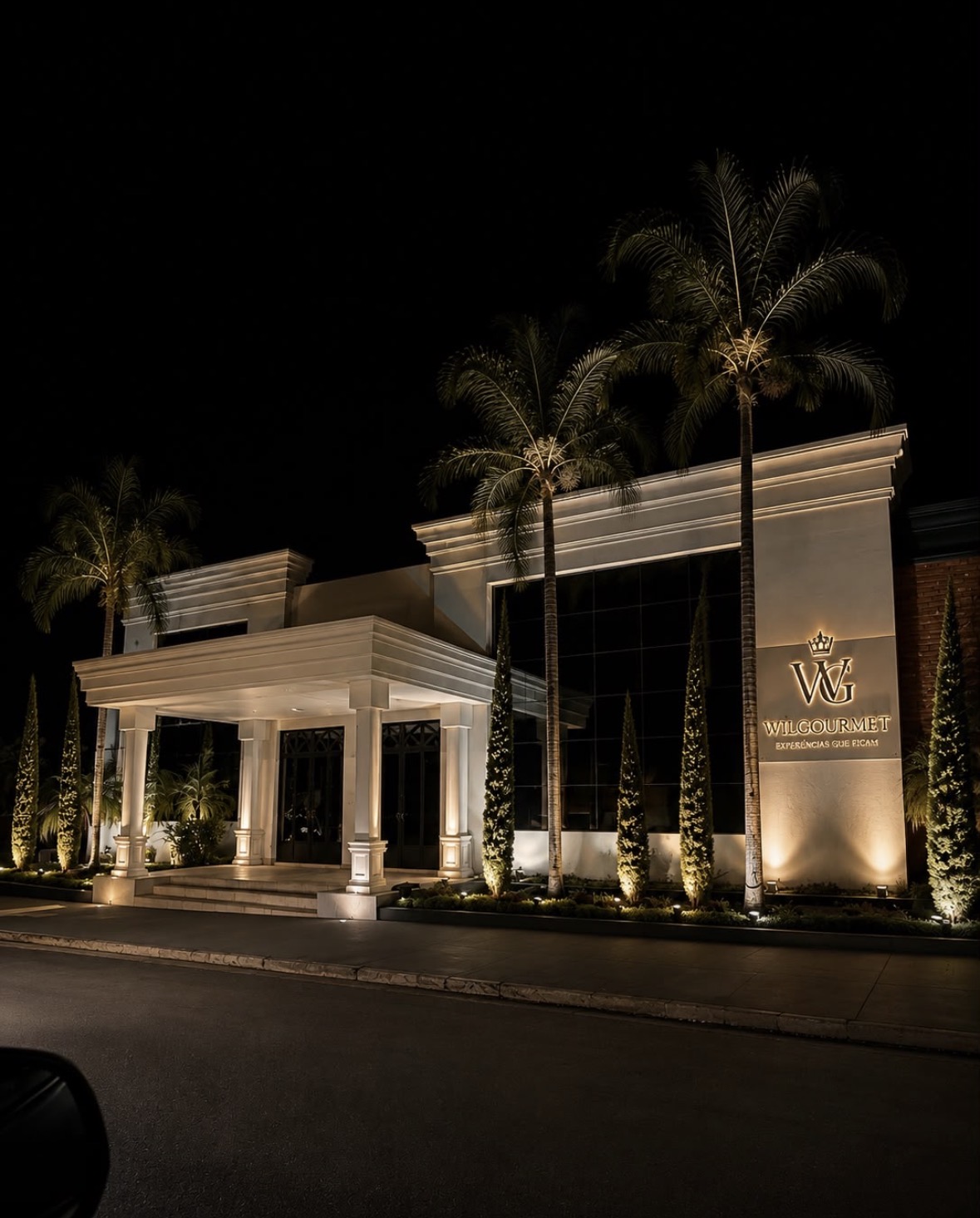 Fachada iluminada do Will Gourmet à noite